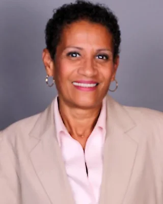 Lourdes Hernandez, health and life insurance specialist, at her desk